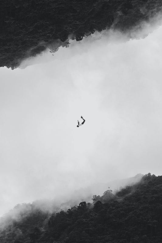 Picture of a person falling in a dream of clouds